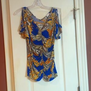 Body Central top. Size Large. Blue , gold chain look design.